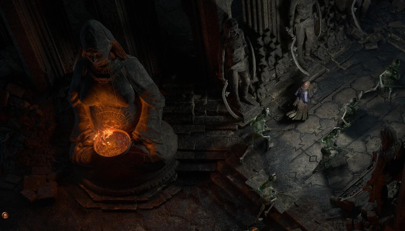 Dark stone temple hall with carved statues and a glowing brazier