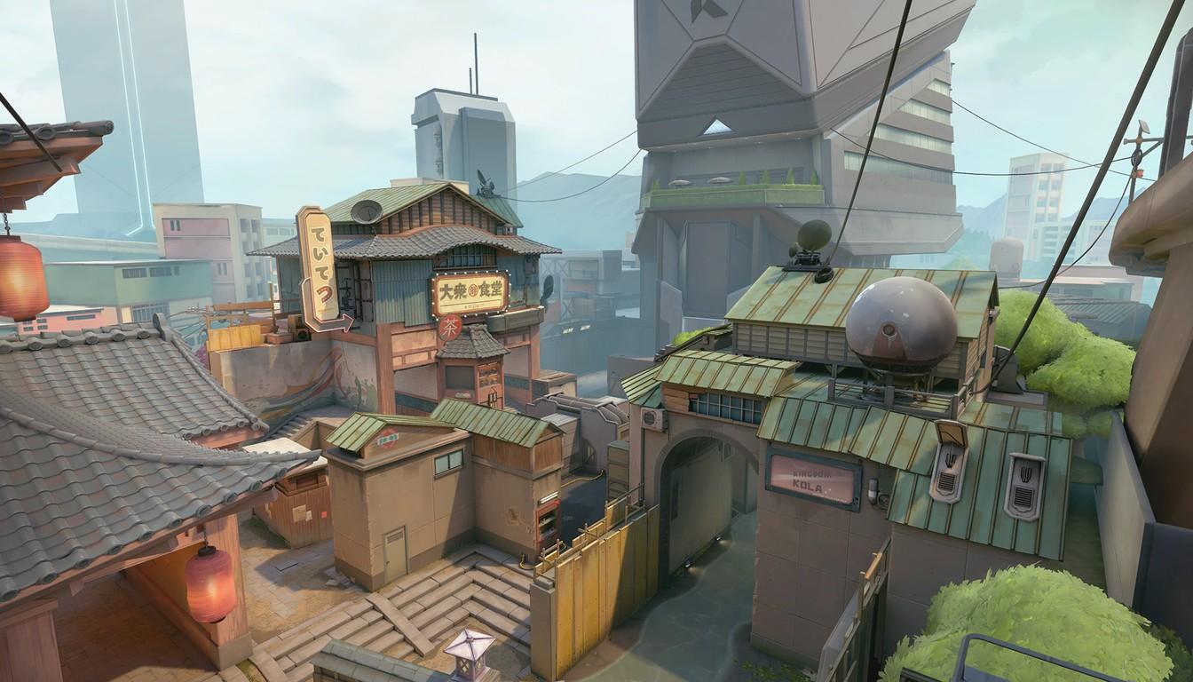 A narrow courtyard with tiled roofs and lanterns between houses