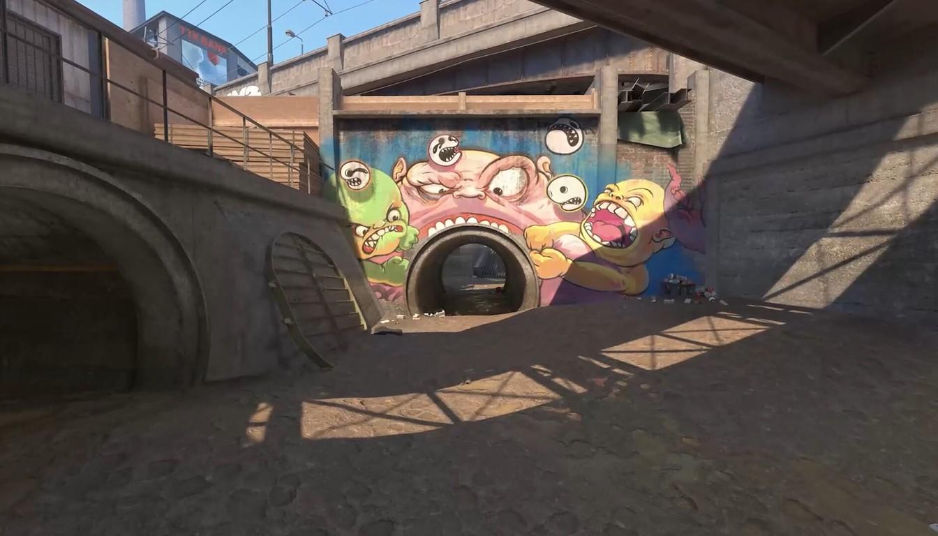 Tunnel under a bridge with colorful graffiti on the wall in CS2