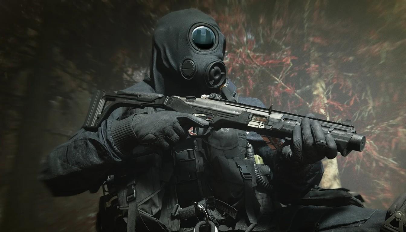 Operator in a gas mask aiming a rifle in a forest