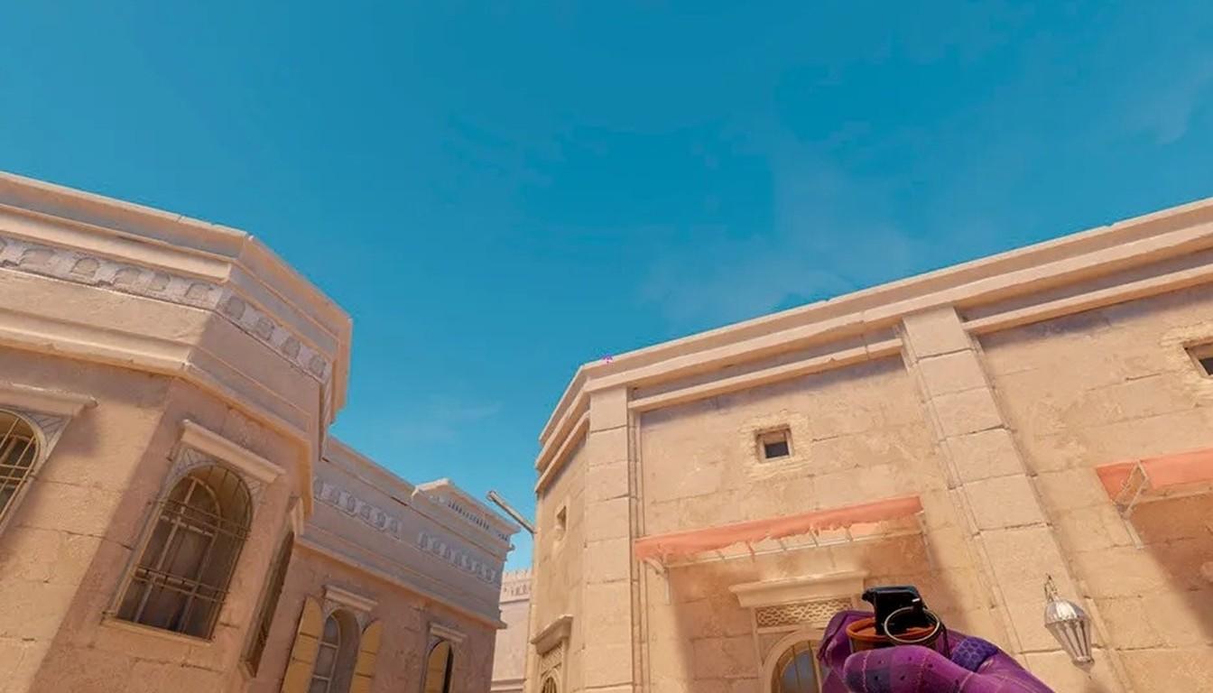 Sandstone buildings with arched windows under a clear sky on Anubis in CS2