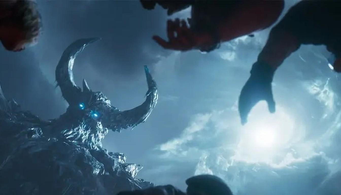 The giant horned Dravakar in a stormy sky above reaching zombie hands in Totenreich