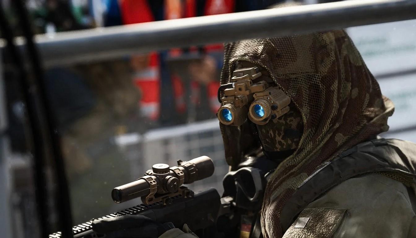 A hooded sniper with night-vision goggles and a scoped rifle in Modern Warfare 4
