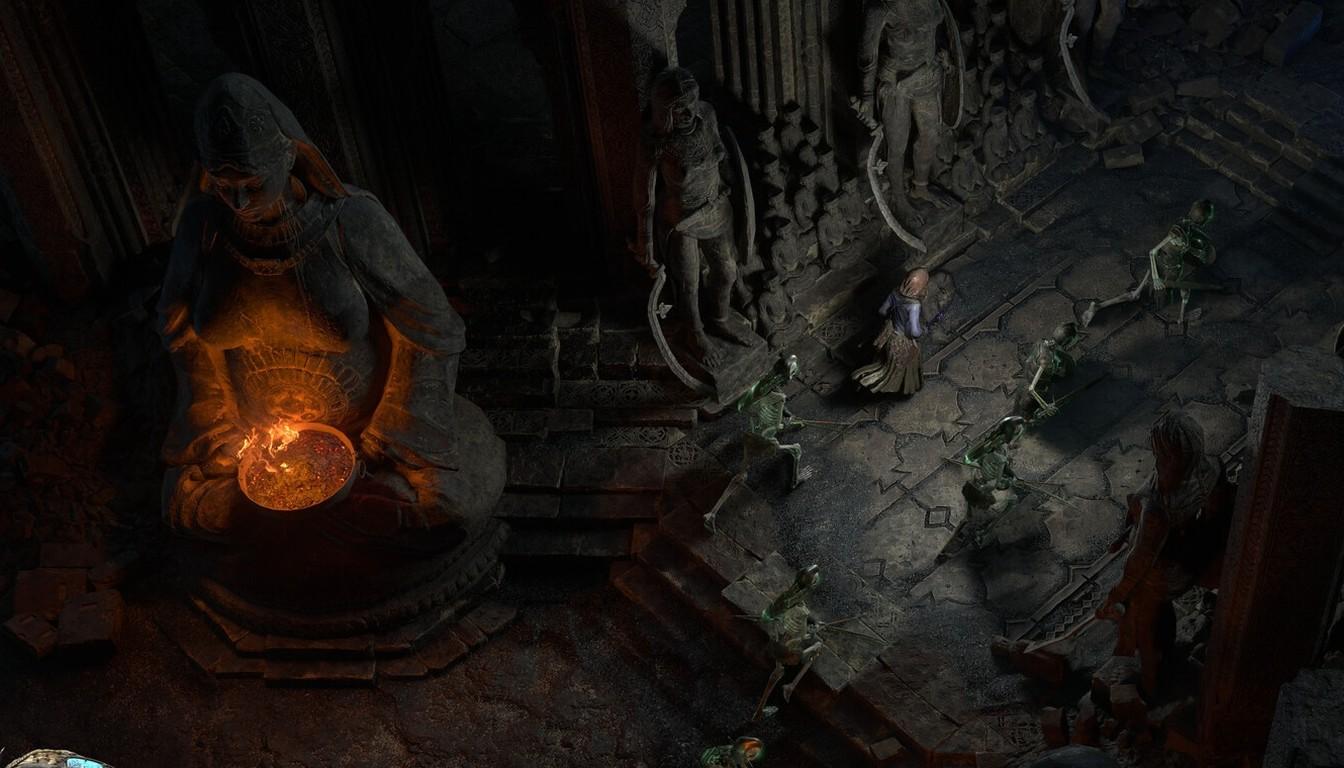 Stone statue in a dark temple holding a glowing orange bowl