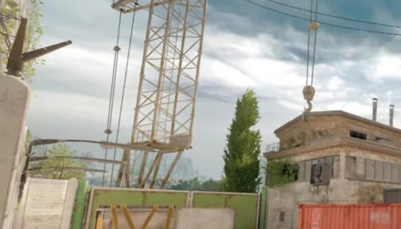 A crane, containers and warehouses in an industrial area on a CS2 map