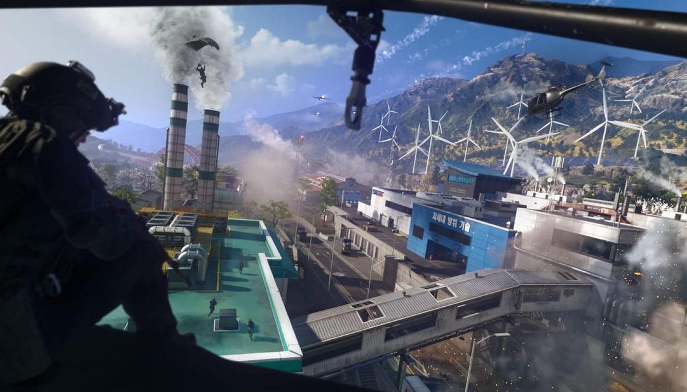 An operator on a rooftop overlooking the Zodiac complex, smoking stacks and mountains