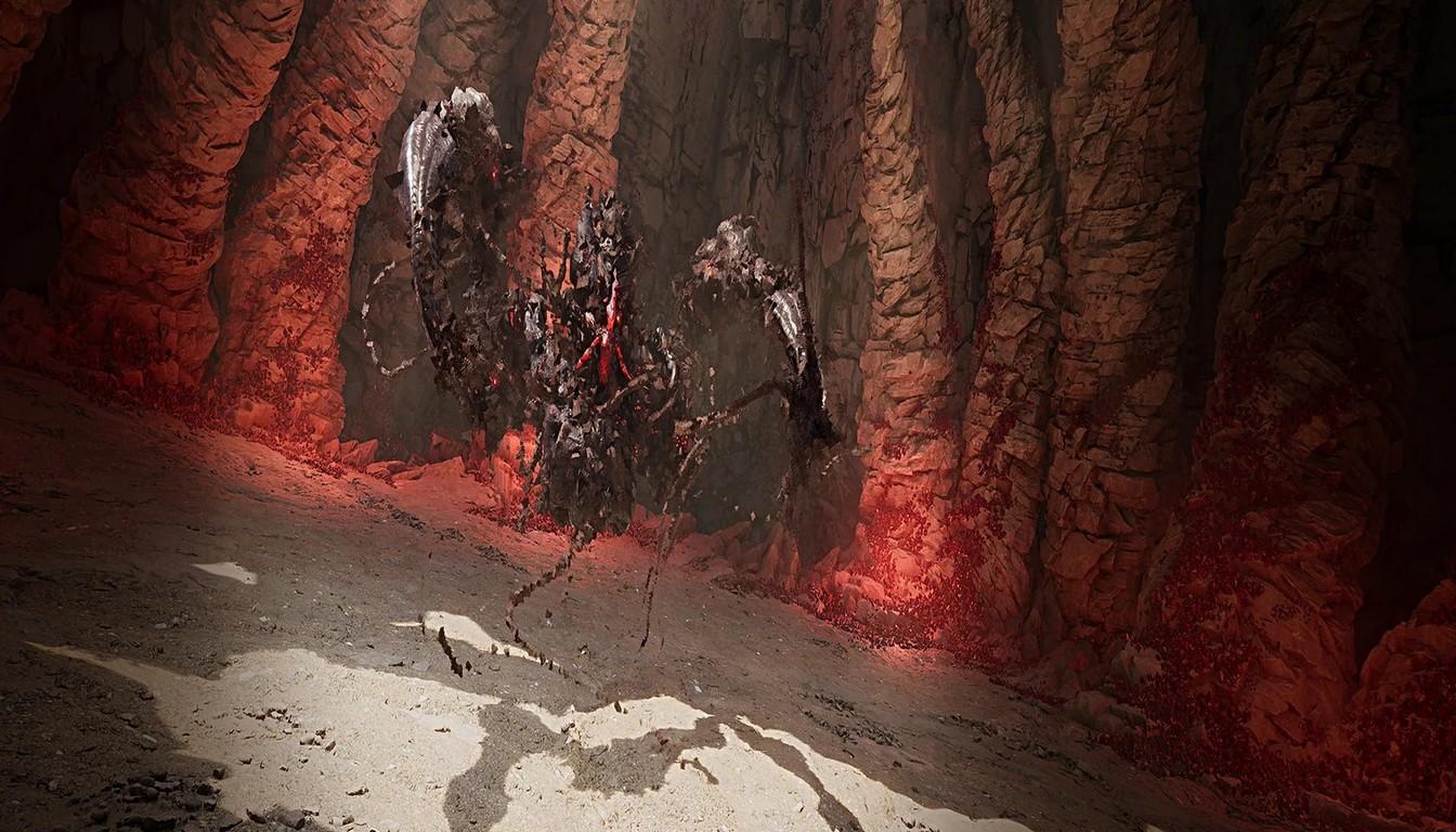 A dark figure by a reddish rock wall deep inside a dungeon cave